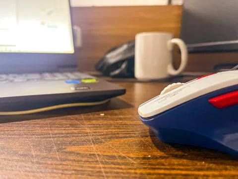 Close Up Of Computer Mouse On Wooden Office Desk Stock Photos