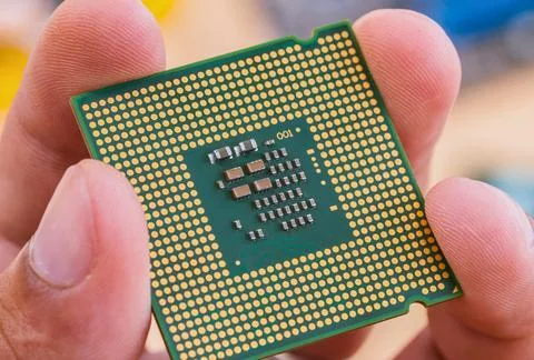 Close up of a computer processor held in hands Stock Photos