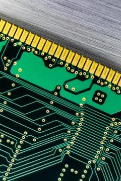 Close up of  computer Ram circuit board on brushed metal background Stock Photos