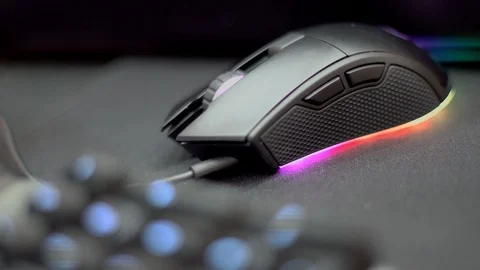 Close up of Computer RGB gaming mouse, Illuminated by colored LED Stock Footage 119158722