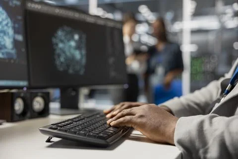 Close up of computer scientist in data center using AI tech to run simulations Stock Photos