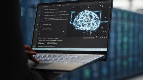Close up of computer scientist working in data center to optimize network Stock Photos