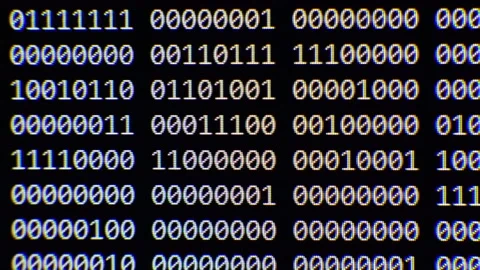 Close up on computer screen binary code on black background. 스톡 동영상 139631174