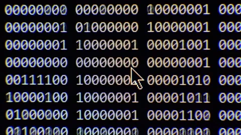 Close up on computer screen binary code on black background. Stockbeeldmateriaal 139631795