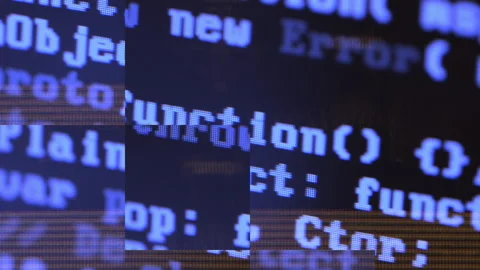 Close up of computer screen with blue programming code, glitch distortion and Stockbeeldmateriaal 320246208