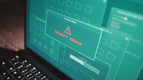 Close up on computer screen with warning alert of security breach hack attempt Видео 330740068