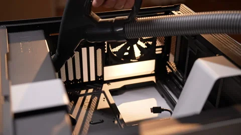 Close-up of computer technician cleaning inside of desktop computer using small Stock Footage 287513237