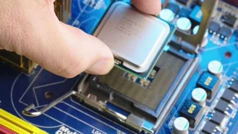 Close up Computer technician install powerful processor on CPU motherboard Stock Footage 170458646