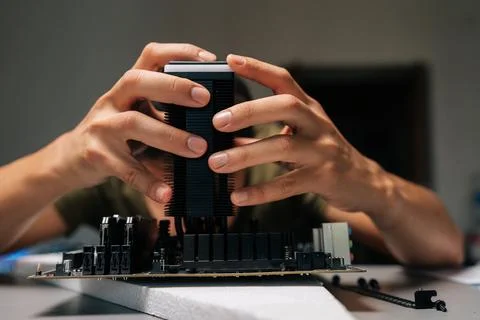 Close-up of computer technician installing CPU cooler onto motherboard Stock Photos