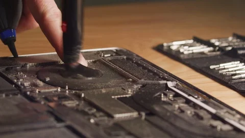 Close up computer technician opening, inspecting, cleaning and fixing Видео 122672125