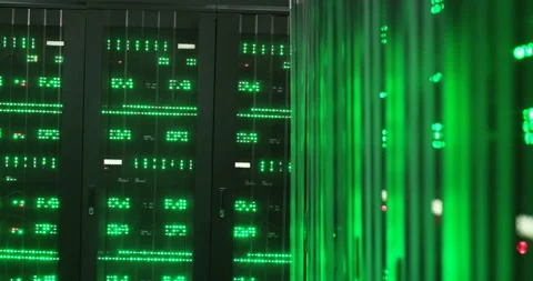 Close up of computers processors with green lights working in dark server room Stock Footage 139450993