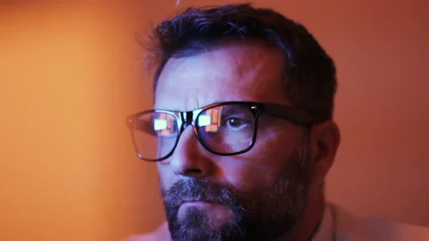 Close Up of Concentrated Male Looking at Computer Screen With Glasses Stock Footage 143239305