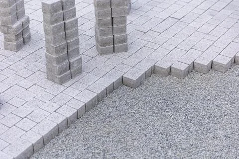 Close up of concrete blocks for new path way, building a new pavement concept 库存照片