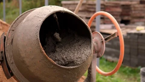 Close-up concrete mixer drum at construction site with rust, mud and cement 스톡 동영상 347693399