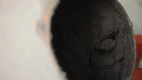Close-Up of Concrete Mixing in Drum Stock Footage 297497482