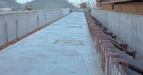 Close-up, concrete poured into a mold, a long concrete beam. Construction site Stock Footage 158406016
