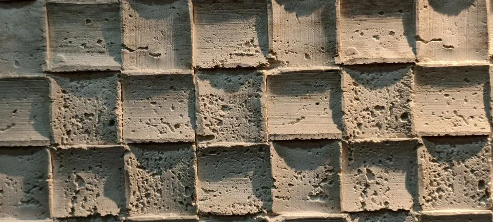 Close‑up of a concrete surface with square indentations Fotos de archivo