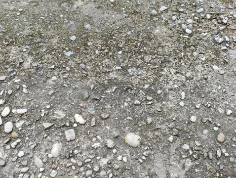Close up on Concrete Surface Texture with Pebbles for Background Stock Photos
