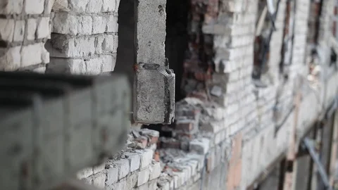 Close-up of a concrete wall destroyed during the fighting Stock Footage 101805652