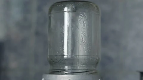 Close-up, condensate droplets drain from the inside of the can preparing for Stock Footage 205037050