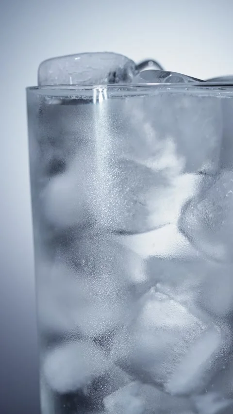 Close-up of condensation on the wall of glass filled with ice cubes Stock-Footage 342728958