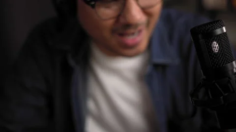 Close-up condenser microphone of content creator man host streaming. Stock Footage 186478321