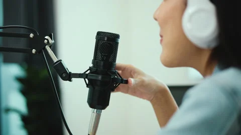 Close-up condenser microphone of content creator woman host streaming. Stock Footage 194613392