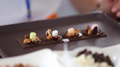 Close up of the confectioner-cook hands squeezes melted chocolate Stock Footage 58313268