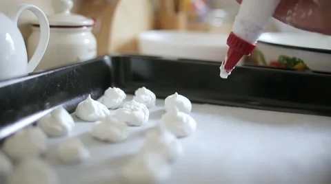 Close up of the confectioner-cook hands squeezes cream and makes parts for cake Stock Footage 68594821