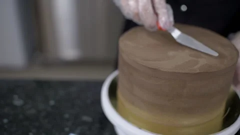 Close-up of confectioner using a knife equals cake up. Video stock 85618030