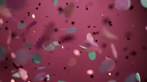Close up of Confetti and Glitter Falling Against a Pink Backdrop Stock Footage 270409814