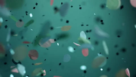 Close up of Confetti and Glitter Falling Against a Teal Backdrop Stock Footage 270409883