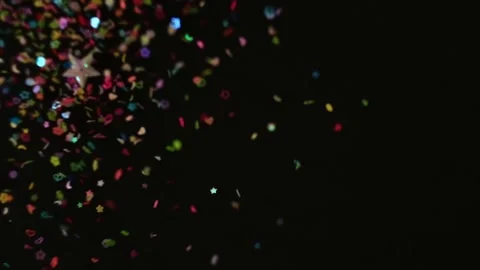 Close up Confetti explosion on black background. Slow Motion confetti falling Stock Footage 151950515