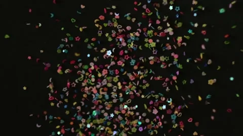 Close up Confetti explosion on black background. Slow Motion confetti falling Stock Footage 152039507