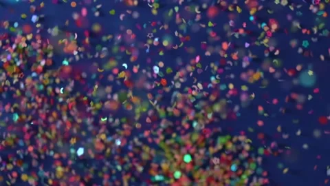 Close up Confetti explosion on black background. Slow Motion confetti falling Stock Footage 152234023