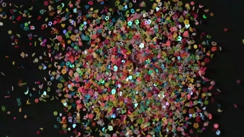 Close up Confetti explosion on black background. Slow Motion confetti falling Stock Footage 152710705