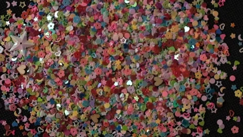 Close up Confetti explosion on black background. Slow Motion confetti falling Stock Footage 152901931