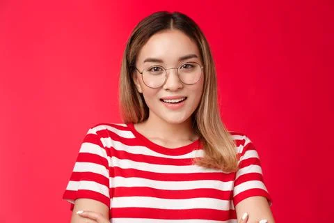 Close-up confident assertive blond asian woman wear glasses cross hands chest Stock Photos