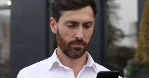 Close up of confident bearded man smiling and looking at camera while standing Stock Footage 140684417