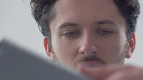 Close up of confident manager helping an employee with a task on tablet. Stock Footage 82226451