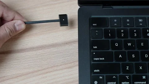 Close up of connecting cable to laptop for charging and data transfer Stock Footage 329625010