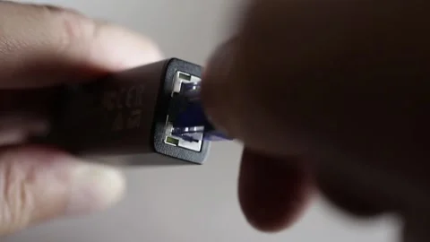 Close-up connecting the ethertner cable to the adapter Stock Footage 155325731