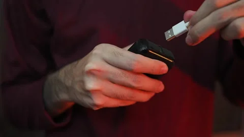 Close Up of Connecting USB Charging Cable to Power Adapter by Hand Stock Footage 337847282