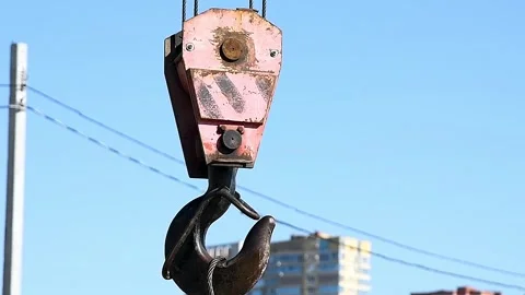Close-up of a construction crane hook performing construction and transport.. Stock Footage 339915454