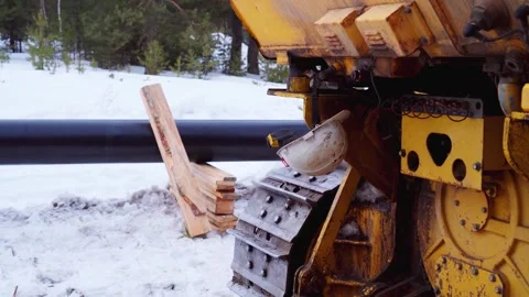 Close-up of a construction crane on the tracks. Construction of a gas pipeline. Stock Footage 268456956