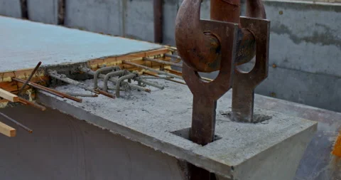 Close-up, a construction elevator lifts a cement construction beam. Large metal Video stock 158403320