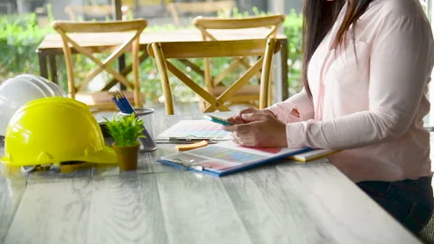 Close up construction engineer woman hands working at office desk architect work Vidéo 205987325