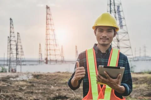 Close up Construction Engineering holding tablet building estate construction Stock Photos