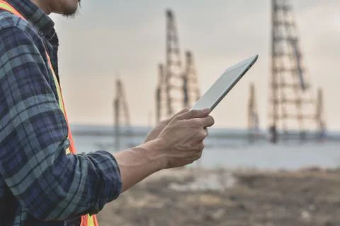 Close up Construction Engineering holding tablet building estate construction Stock Photos