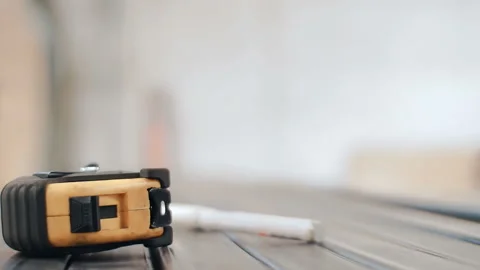 Close-up of a construction plastic roulette on a metal surface Stock Footage 88588156